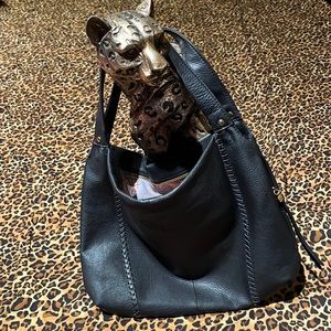 NewHobo International Brand handbag. This bag is black with gold toned hardware.